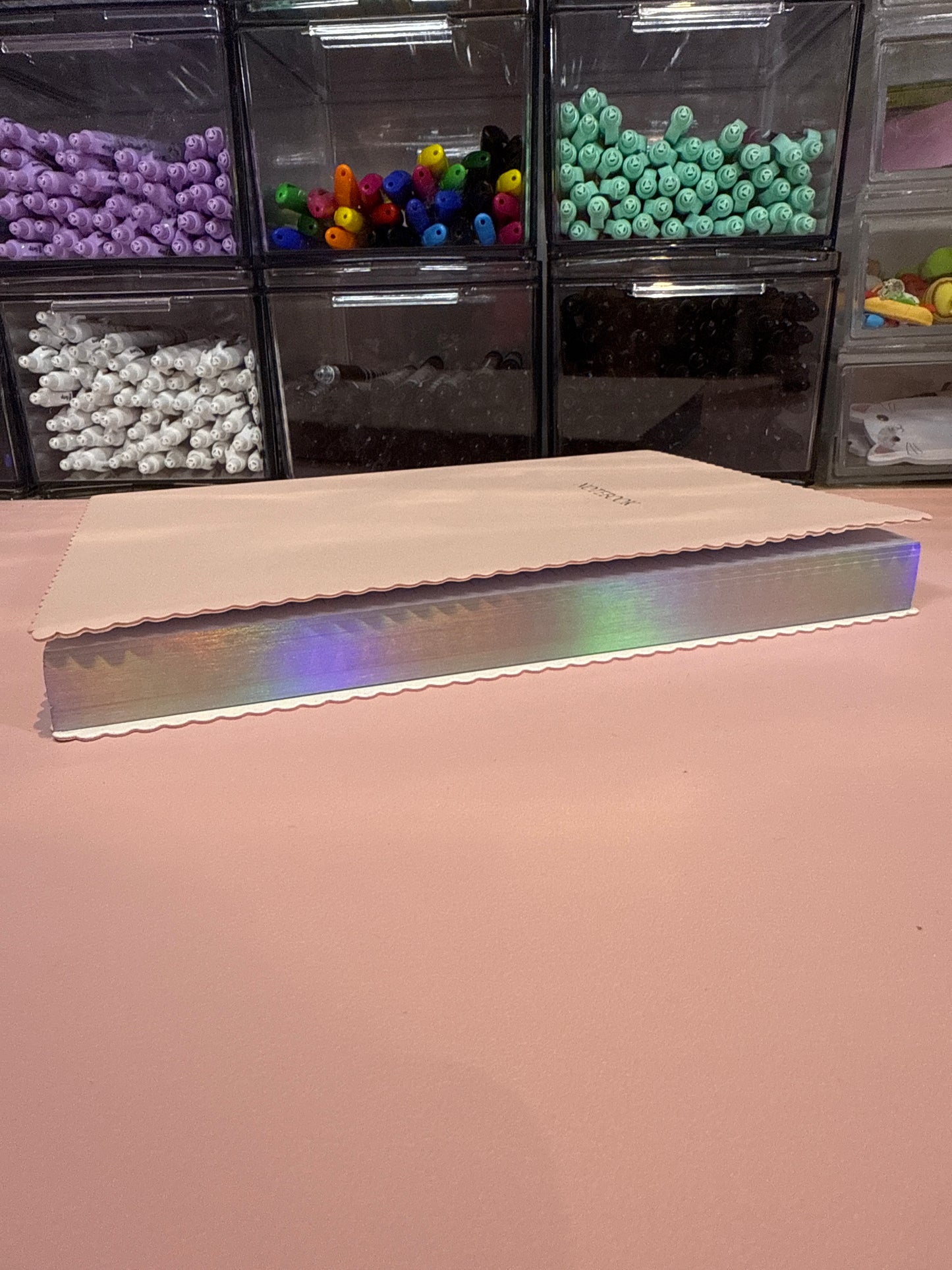 Scalloped edged pink notebook with holographic edges