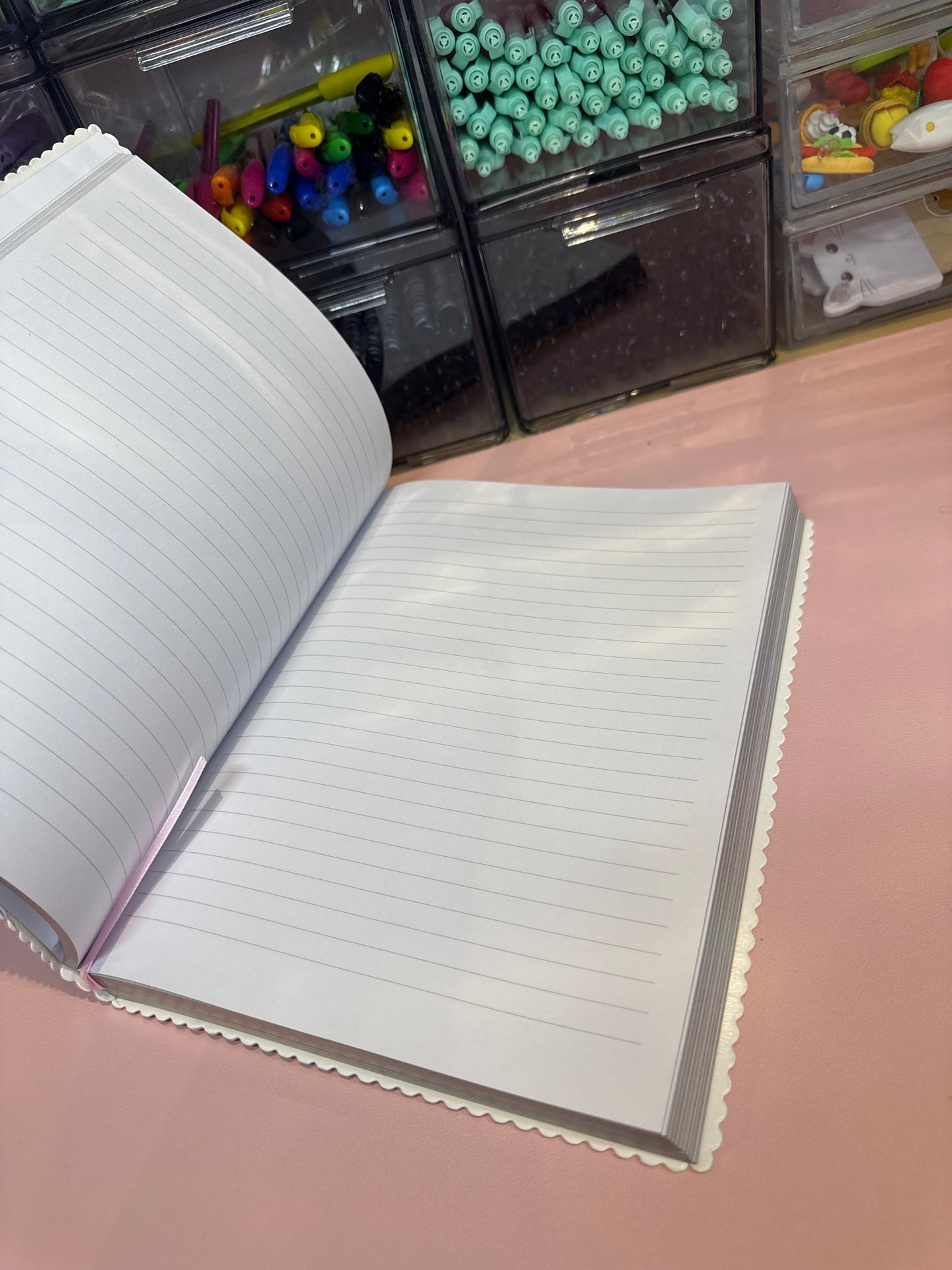 Scalloped edged pink notebook with holographic edges